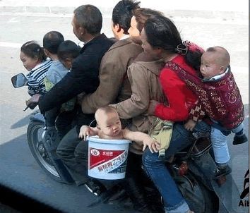 thai family on motorbike